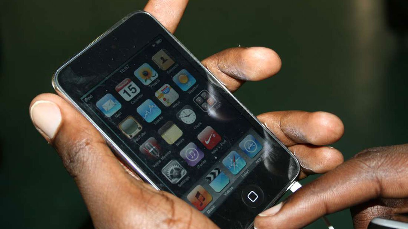 A Kenyan clutching a smartphone. CredoLab has launched in Kenya seeking to ‘drive financial inclusion’ by credit scoring more people. www.businesstoday.co.ke