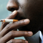 A man smoking cigarette www.businesstoday.co.ke