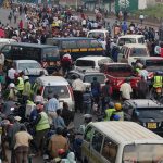 Matatus and boda boda riders at a busy terminus. 29 companies have been licensed to provide a cashless payment platform.