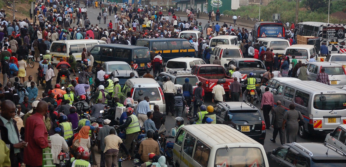 Matatus and boda boda riders at a busy terminus. 29 companies have been licensed to provide a cashless payment platform.