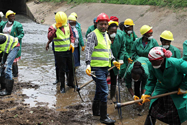 Nairobi Governor inspects a Nairobi river clean up exercise in May. The cleaning staff are lamenting four months salary arrears. www.businesstoday.co.ke