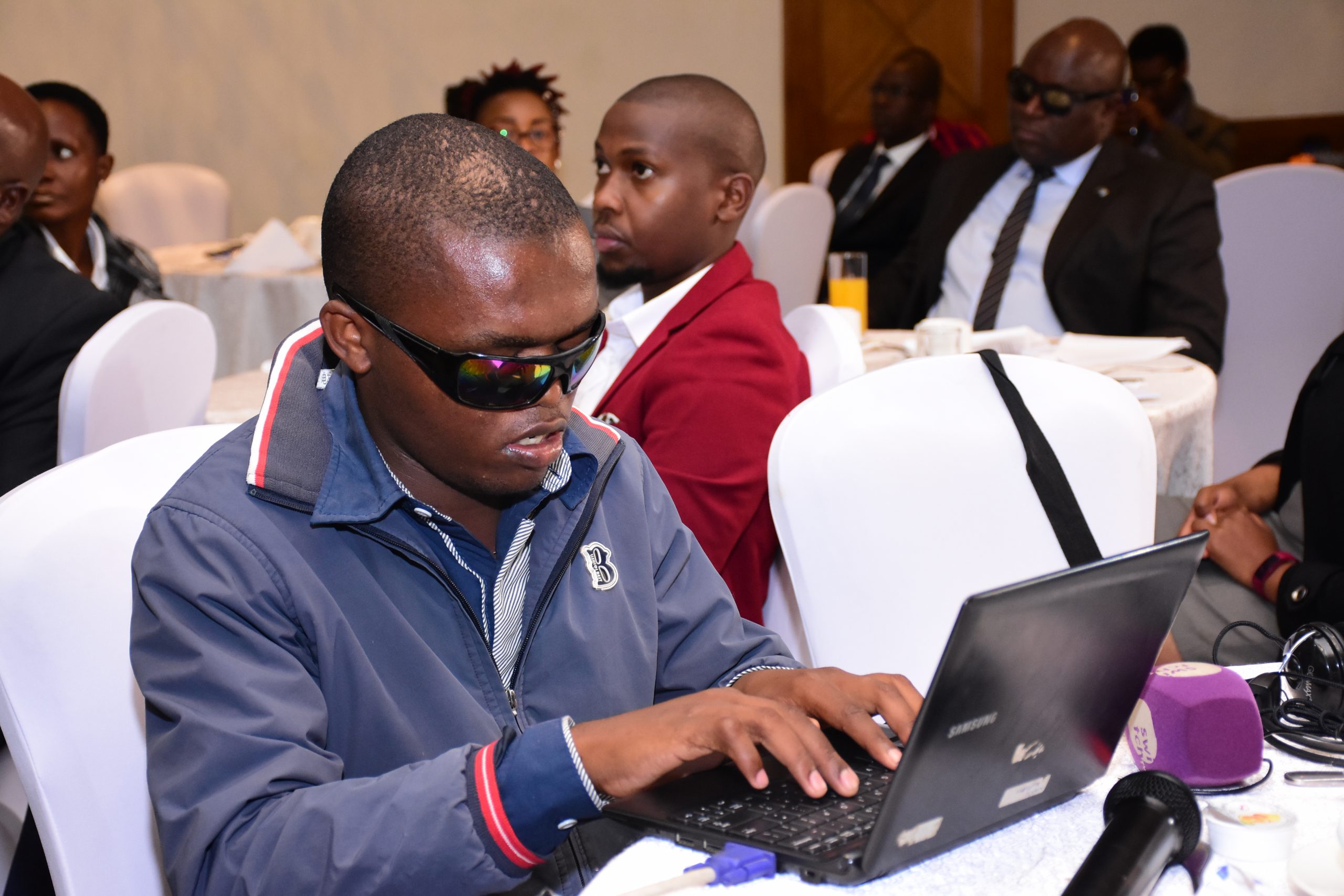 Anthony Wambua using his laptop. He has gone against all odds to learn how to code using special technology. www.businesstoday.co.ke