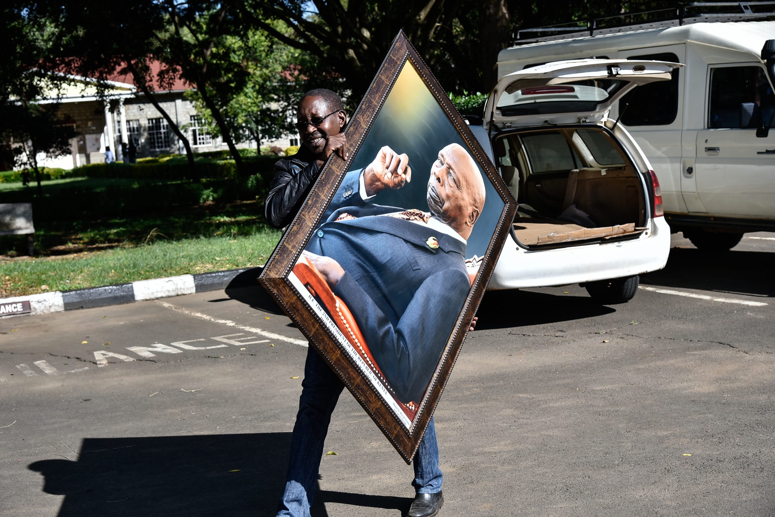 David Namu delivering the iconic portrait of the late President Daniel Moi. Working as a photographer, Namu became one of the late president’s favourites from the battery of journalists covering his events. www.businesstoday.co.ke