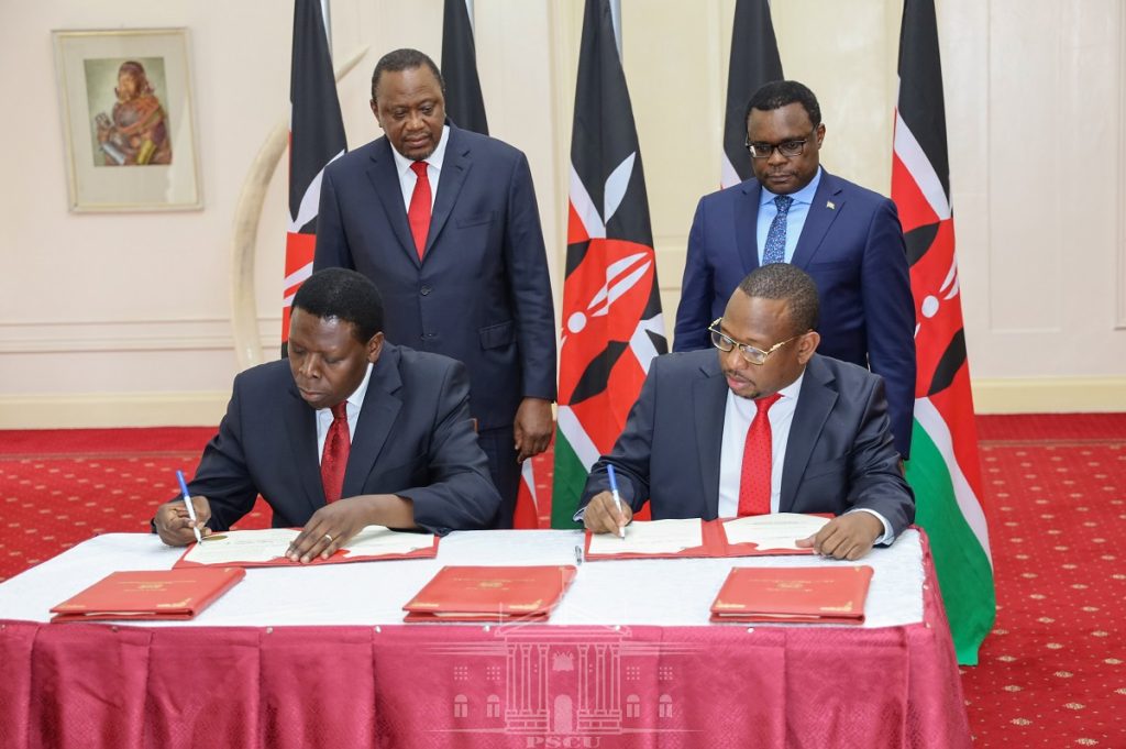 Mike Sonko signs the documents to surrender some functions of the county to the national government. Questions abound if the exercise was legal. www.businesstoday.co.ke