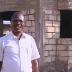 Hezron next to his home after investing in affordable plots in Ngong. www.businesstoday.co.ke