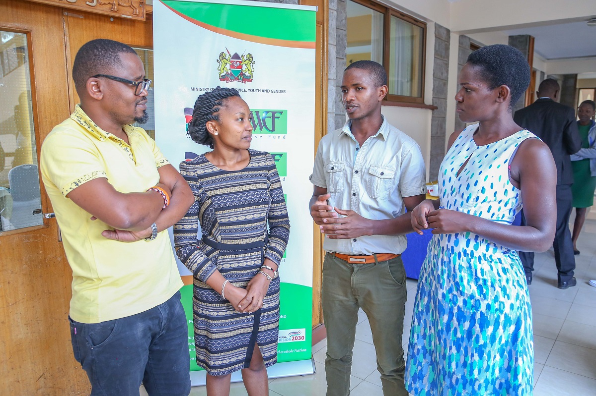 WEF Head of Monitoring &Evaluation, Collins Okoth (L) and Communication manager Ruth Randa (Right) dialogues with Trainers Rhoda Njeri and Timothy Hinga during the Training for Trainers session held at the KICD Centre in Nairobi on Thursday. www.businesstoday.co.ke