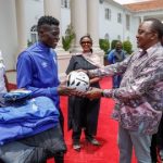 President Kenyatta gives a signed ball to AFC Leopards captain Robinson Kamura while Sports CS Amb. Amina Mohamed looks on. www.businesstoday.co.ke