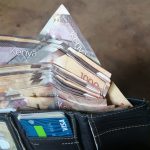 Notes in a wallet. Many Kenyans turned to entrepreneurship following the onset of the Covid-19 pandemic.