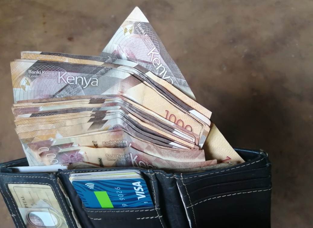 Notes in a wallet. Many Kenyans turned to entrepreneurship following the onset of the Covid-19 pandemic.