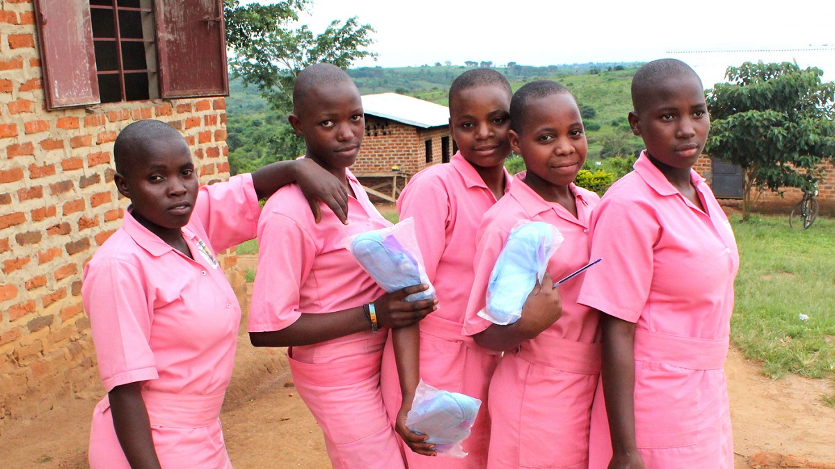 School girls with free pads. The #AchieveMoreGirl project seeks to reduce school absenteeism among adolescent girls during menstruation by promoting menstrual health and access to products. www.businesstoday.co.ke