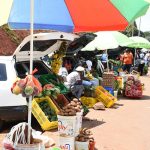 Kenyans pictured selling fruits and vegetables out of their cars