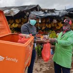 Sendy CEO Meshack Alloys and Kenyatta Market Trader John Mutinda.