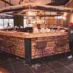 DJ Joe Mfalme poses at The Tap lounge in Nairobi