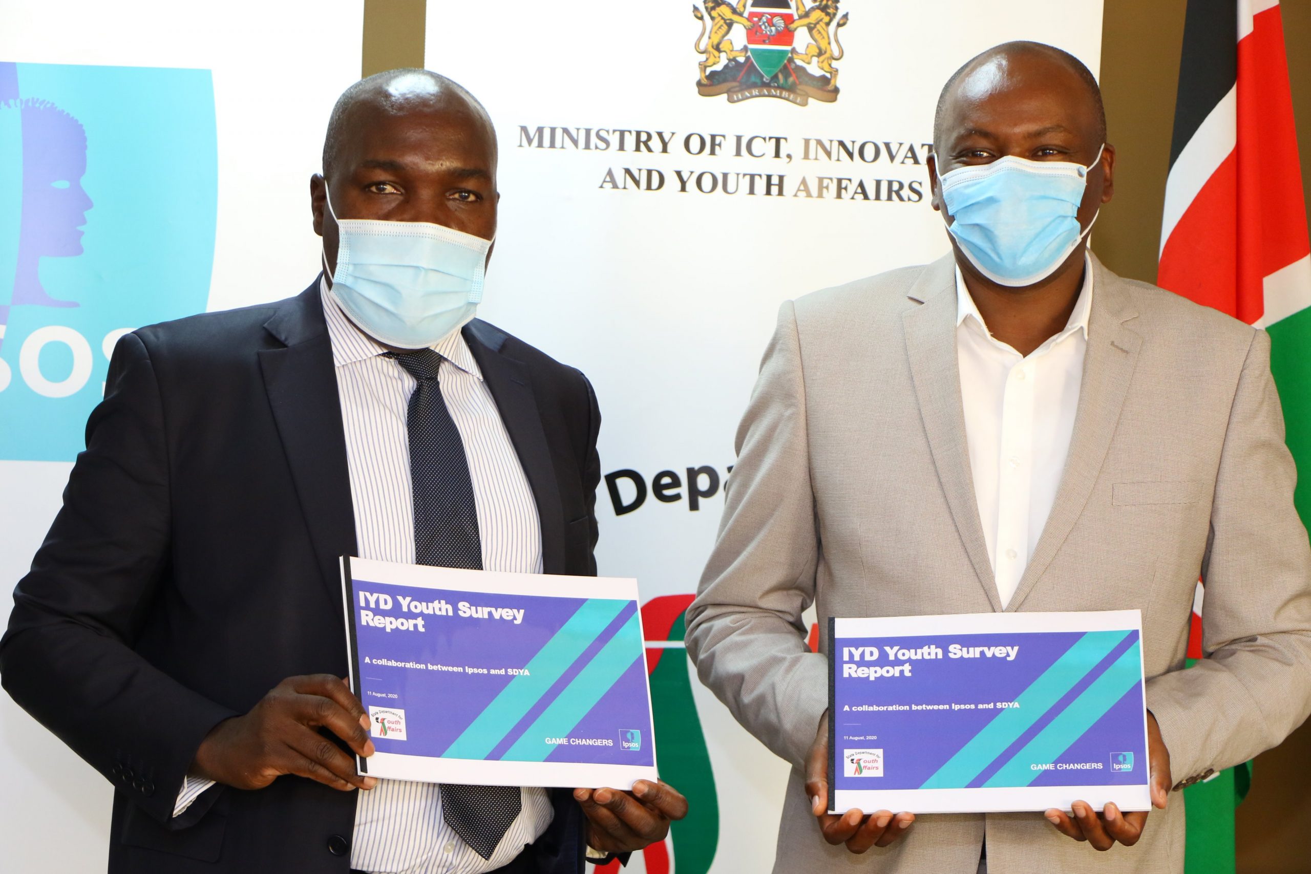 Ipsos Managing Director Chris Githaiga (right) poses with Youth Affairs PS Julius Korir after a ceremony on December 15, 2020.