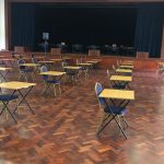 An auditorium at Peponi School with socially distanced desks.