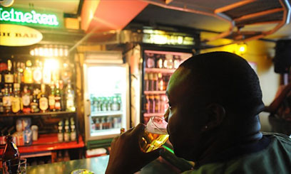 A man sips a drink at a pub. Nyeri County Government has waived annual license fees for clubs, bars and restaurants by 25 per cent.