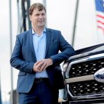 Ford Motor Co. CEO Jim Farley poses next to a new 2021 Ford F-150 pickup truck at the Rouge Complex in Dearborn, Mich., on Sept. 17, 2020.