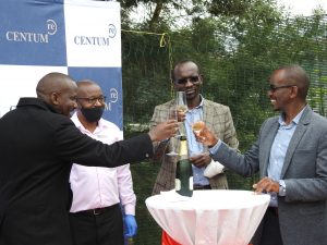 Heri Homes CEO Kimotho Kimani (in black Jacket) and Centum Re MD Sam Kariuki (right) toasting during the Cascadia Open Day at Two Rivers on February 24, 2021