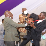 Mps fight at funeral