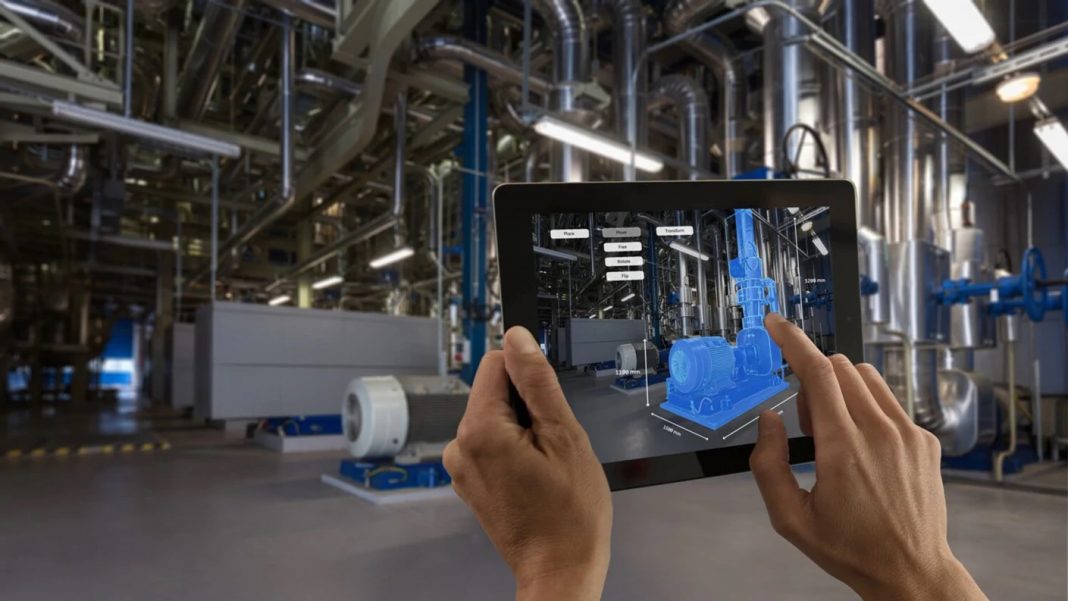 A factory worker using Augmented Reality (AR) technology