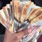 A man holding Ksh1,000 shilling notes. The latest Knight Frank Wealth Report offers interesting insights on Kenya's super rich.