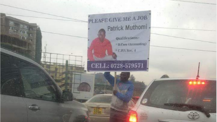 g A job-seeking graduate waves a placard on the streets of Nairobi. Helb has opposed amendments to the Helb act seeking to cushion unemployed graduates from fines.