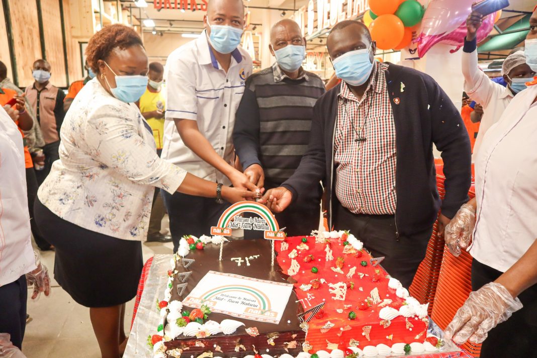 A cake is cut to celebrate the opening of Naivas' 71st store. The store in Nakuru represents a dream come true for the supermarket chain which started with a small store in Rongai, on the outskirts of Nakuru.