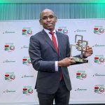 Safaricom CEO, Peter Ndegwa, poses for a photo with the GSMA Outstanding contribution to the mobile industry award.