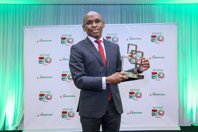 IMAGE 3 Safaricom CEO, Peter Ndegwa, poses for a photo with the GSMA Outstanding contribution to the mobile industry award.