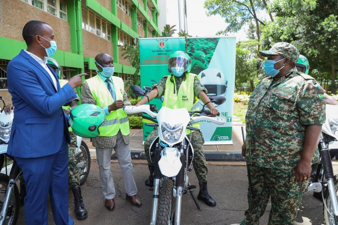 IMG2 L – R; Micah Kenneth - Regional Manager, Bolt East Africa hands over a helmet and a reflective jacket to George Njao- Director General at NTSA and Matilda Sakwa – Director General at National Youth Service (NYS) during a handover ceremony of safety gears at the NYS headquarters in Nairobi. Bolt donated over 120 safety gears including helmets, reflective jackets and first aid kits to NTSA and NYS as part of its support and contributions towards the National Government Boda Boda Rider Training Programme launched in February 2021 to address the increasing road safety challenges in the Boda Boda Sector.