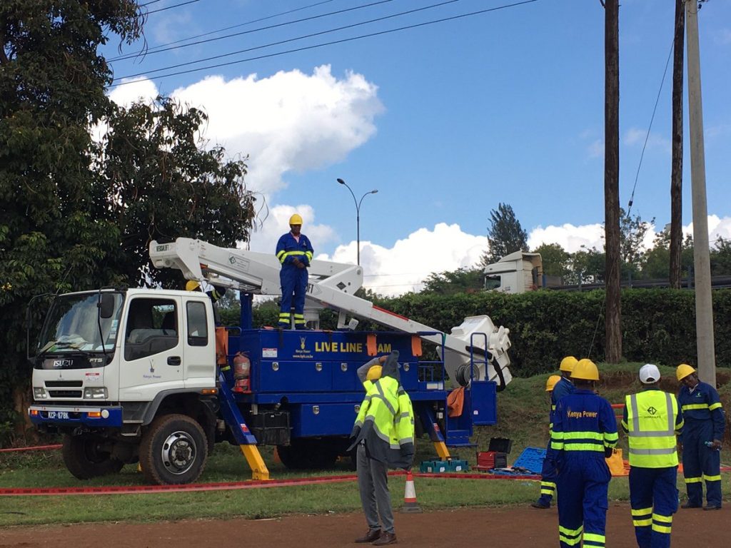 Kenya Power technicians at work. The National Fibre Optic Backbone project was initiated by former President Mwai Kibaki's administration in 2007.