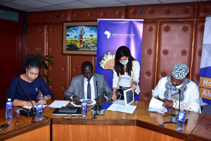 Triangle Real Estate Chief Executive Officer Amb. Arop Deng Kuol, and Shelter Afrique Chief Executive Officer Andrew Chimphondah sign the USD1.5bn housing deal in Nairobi witnessed by Benchmark Solutions Managing Director Laura Akunga and Shelter afrique's head of legal Houda Boudlali.