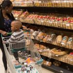 A shopper looks at bread at a supermarket. Several bread manufacturers have been found violating numerous regulatory standards following an investigation by the Competition Authority of Kenya (CAK).