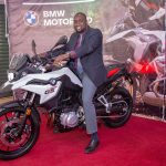 Inchcape Kenya Ltd MD Hussein Ibrahim with a BMW motorbike during the launch of the BMW Motorrad showroom