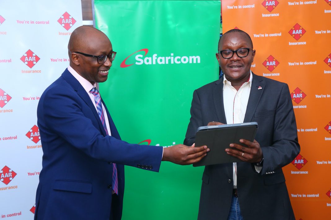 AAR Insurance Kenya Managing Director Nixon Shigoli (Right) and Safaricom Head of Department-Large Enterprise and Public Sector Joseph Wanjohi soon after signing a deal that will see the medical underwriter migrate its digital tools and core systems to the Amazon Web Services (AWS) platform, a move set to offer AAR Insurance Kenya clients more secure and efficient digital services.