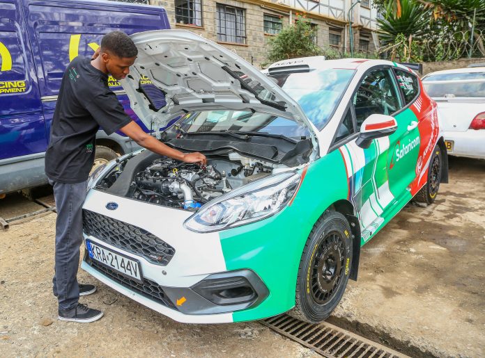 IMG -3 McRae Kimathi inspects the engine car in preparation for the African Rally Championship to be held in Tanzania from 23rd – 25th July, 2021.