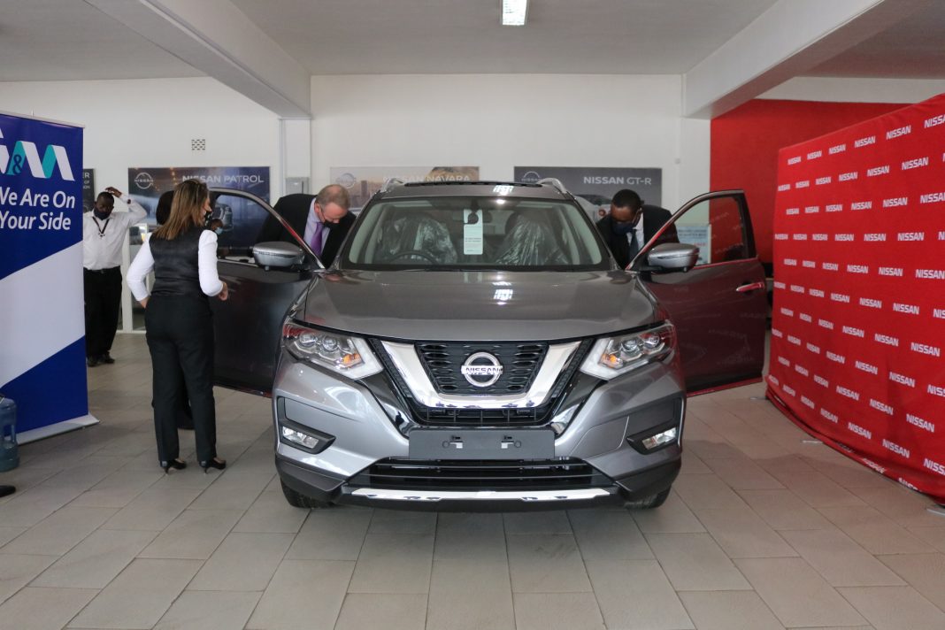 I&M Bank Limited CEO Mr. Kihara Maina (R) and Crown Motors Group Managing Director, Tony Voorhout (L) viewing the Nissan Xtrail vehicle, at the launch of the partnership between the companies, where the Bank will provide up to 100% Asset Financing to its customers for Crown Motors Group vehicles at competitive interest rates, extended repayment periods of up to 5 years, an enriched comprehensive motor insurance package at a discounted premium rate, Insurance Premium Financing and a two-month repayment holiday.