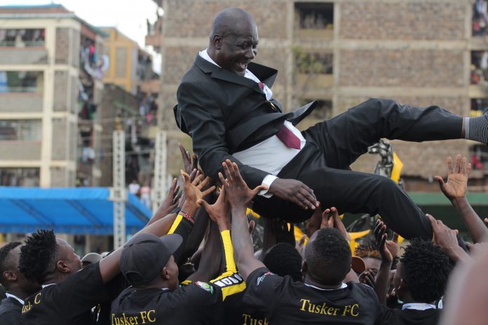 Tusker FC players toss coach Robert Matano in the air after being crowned league champions on August 22, 2021. [Photo/ @tusker_fc]