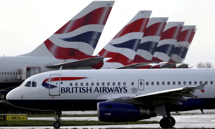A British Airways plane. Prior to travel customers will also receive details of how they can prepare for their journey, including information on discounted testing providers. [Photo/ Simon Dawson/ Reuters]