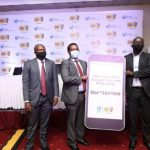 Mr Bob Musinguzi, Manager SCD-USE (l),Paul Bwiso, the Chief Executive Officer, Uganda Securities Exchange (c) pose for a photo alongside Mr. Stephen Mutana,(r) the Chief Executive Officer MTN Mobile Money Limited during the launch of the digital Securities Central Depository (SCD) account opening platform in Kampala
