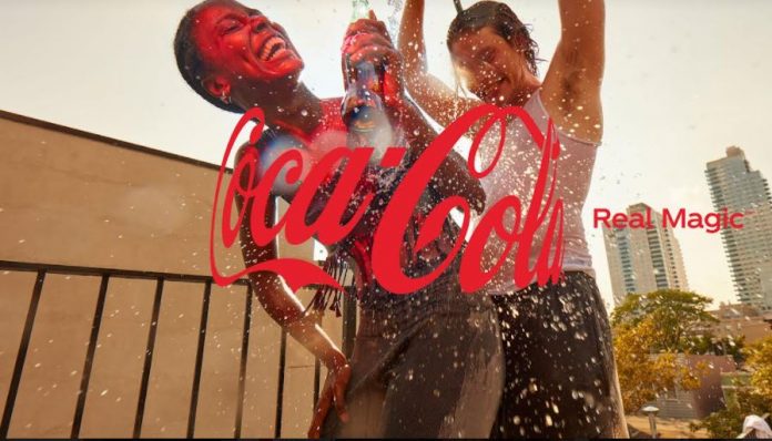 Coca-Cola is collaborating with artists, photographers, and illustrators to bring the concept of Real Magic to life through the embrace of the Hug logo. Coca-Cola is collaborating with artists, photographers, and illustrators to bring the concept of Real Magic to life through the embrace of the Hug logo.