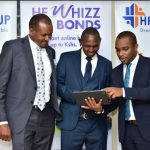 HF Group CEO Robert Kibaara (Left) and Head of Trade Finance, Oscar Muva (Right) demonstrate the HF Whizz Bid Bonds platform to a customer, James Wagura of Recolte Ltd. The online platform enables customers generate instant unsecured bid bonds of up to Ksh. 10 million.