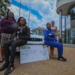 Rally Driver Maxine Wahome (R) and her co-driver Linet Ayuko (L) pose for a picture after Safaricom’s sponsorship cheque handover.