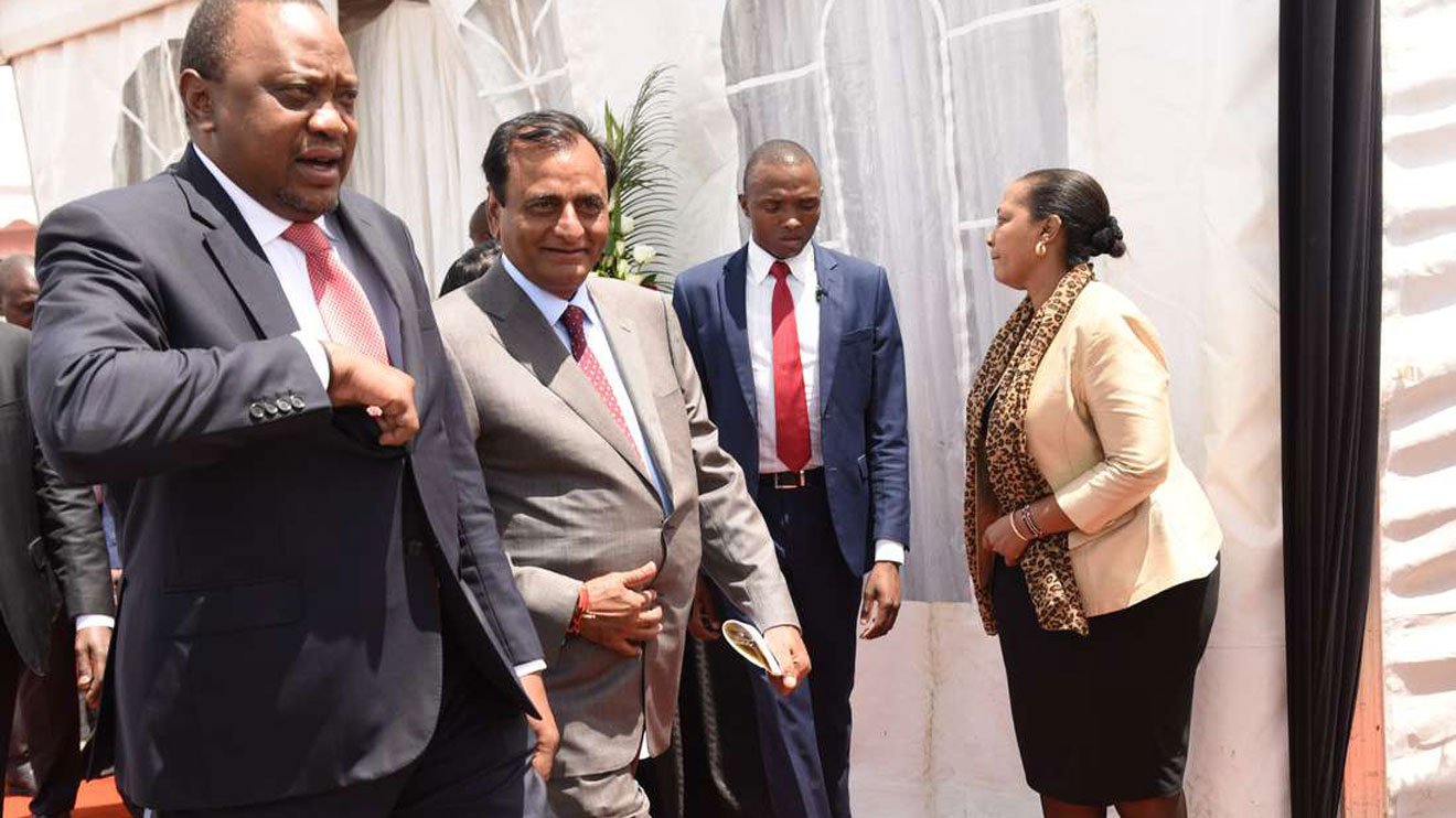 President Uhuru Kenyatta pictured with Devki Group Founder and CEO Narendra Raval. The state has reportedly been considering raising import duties on clinker. [Photo/ NMG]