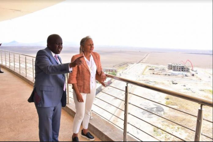 Konza Technopolis Development Authority CEO Eng. John Tanui (Left) orients the Central Bank of Kenya Deputy Governor Mrs. Sheila M'Mbijjewe (Right) on the ongoing projects at Konza Technopolis at a birds eye view.
