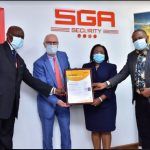 SGA CEO & Chairman Julius Delahaije & Special Projects head Simon Katuva receive the ISO18788 Certificate from Intertek Regional Manager Millicent Njuguna & Business Assurance Coordinator George Mathu