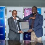 Stanbic Bank Kenya Chief Finance and Value Officer, Abraham Ogenge (Left) and Inchcape Kenya Managing Director Hussein Ibrahim (Right) during the signing of the Partnership between Stanbic Bank and Inchcape Kenya.
