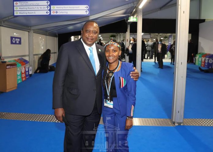 k President Uhuru Kenyatta pictured with environmentalist Elizabeth Wathuti at the ongoing COP26 summit in Edinburgh, Scotland.