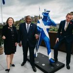 President Uhuru Kenyatta poses with a life-size Johnnie Walker statue in Edinburgh, Scotland flanked by UK State Secretary for International Trade Anne-Marie Trevelyan and Diageo's Global Supply Chain & Procurement and Chief Sustainability Officer Ewan Andrew.