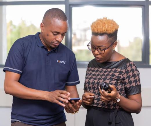 Sendy Fulfillment General Manager-East Africa Chris Nyaga takes Safe Cosmetics owner Hellen Gathigia through the Sendy Fulfillment platform during the launch of its Fulfillment services to online retailers. 
